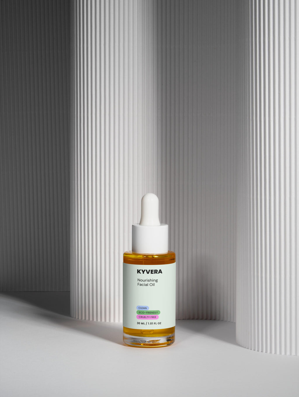 Nourishing Facial Oil in a glass dropper bottle on a textured background, designed for hydration and skin repair.