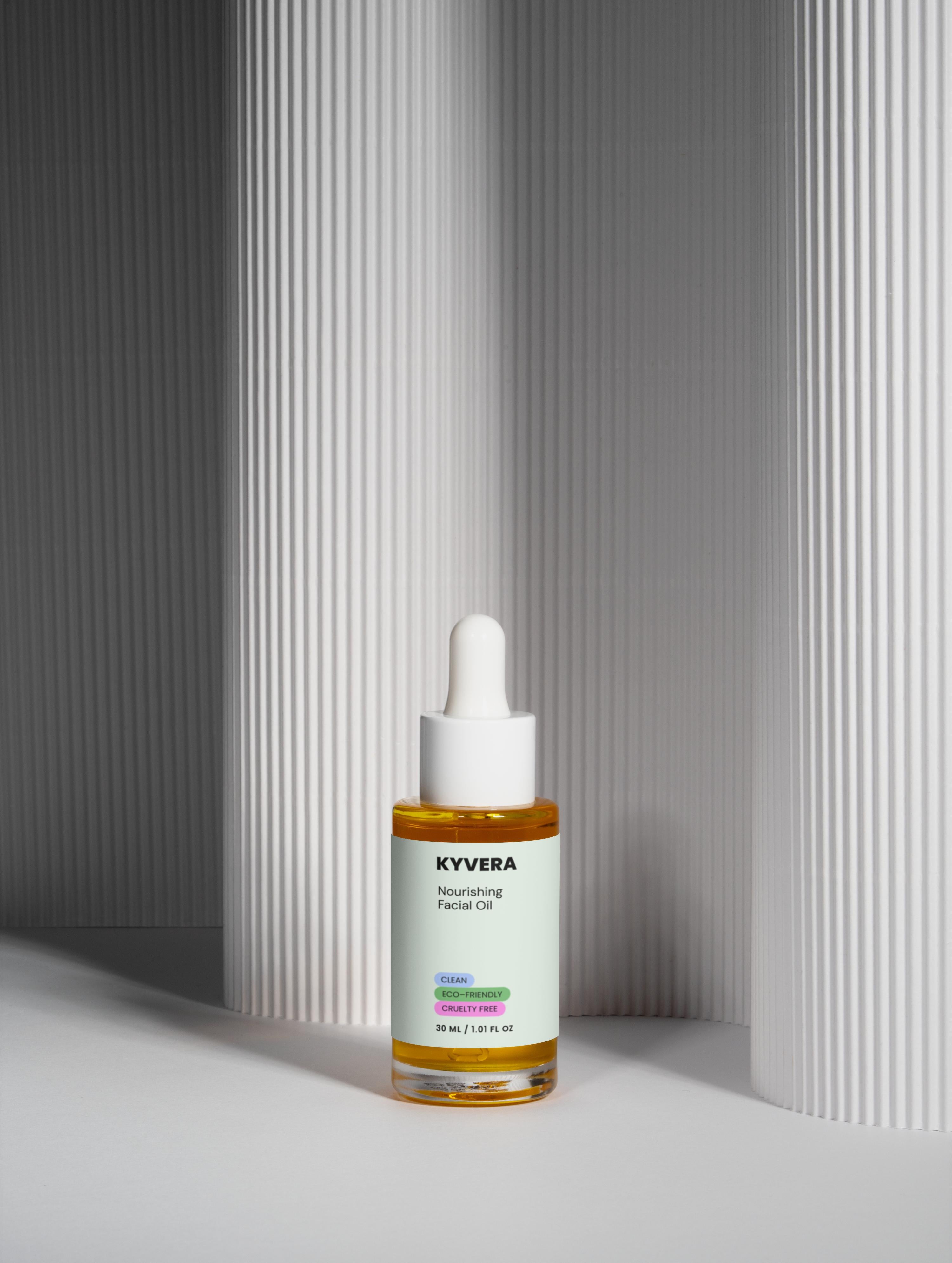 Nourishing Facial Oil in a glass dropper bottle on a textured background, designed for hydration and skin repair.