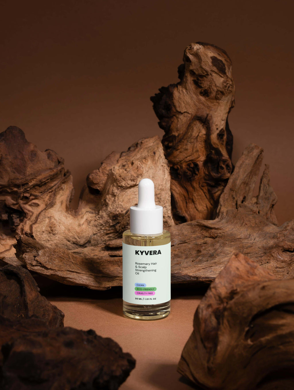 Rosemary Hair&Scalp Oil bottle surrounded by rustic wood, showcasing hydrating and strengthening hair treatment.