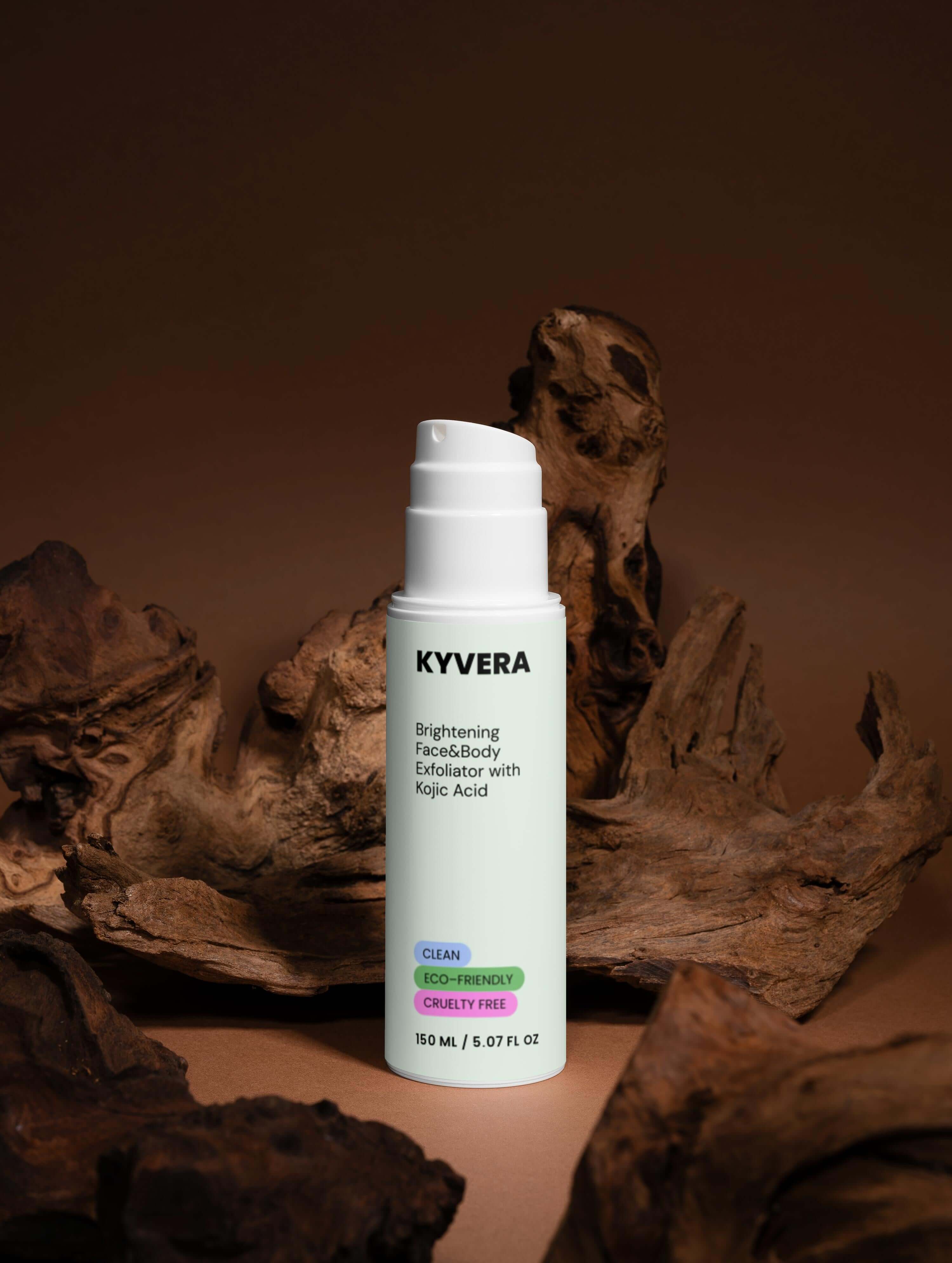 Kojic Acid Body&Face Exfoliator by Kyvera in a clean design, set against a warm wooden background.