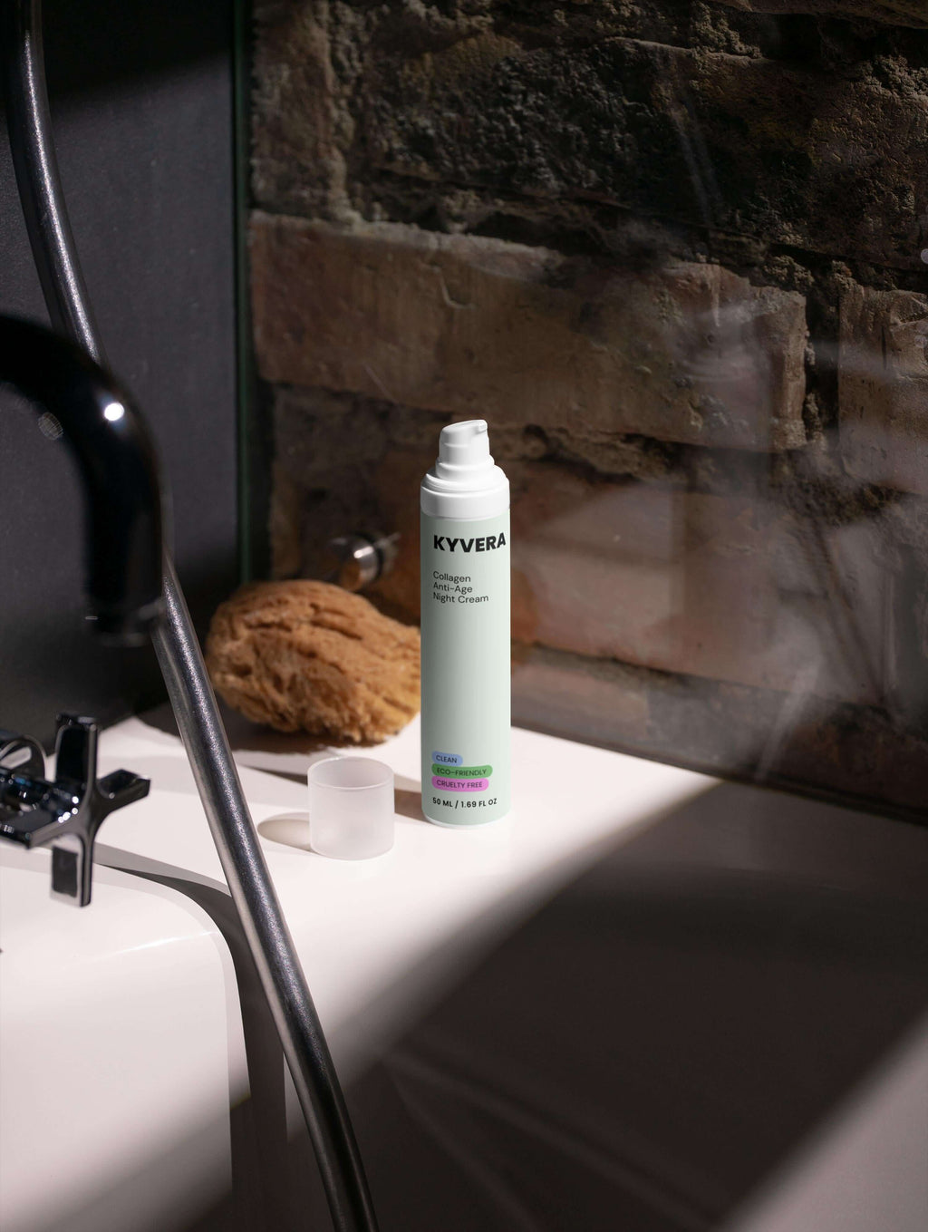 Collagen Anti-Age Night Cream on a bathroom surface next to a natural sponge.
