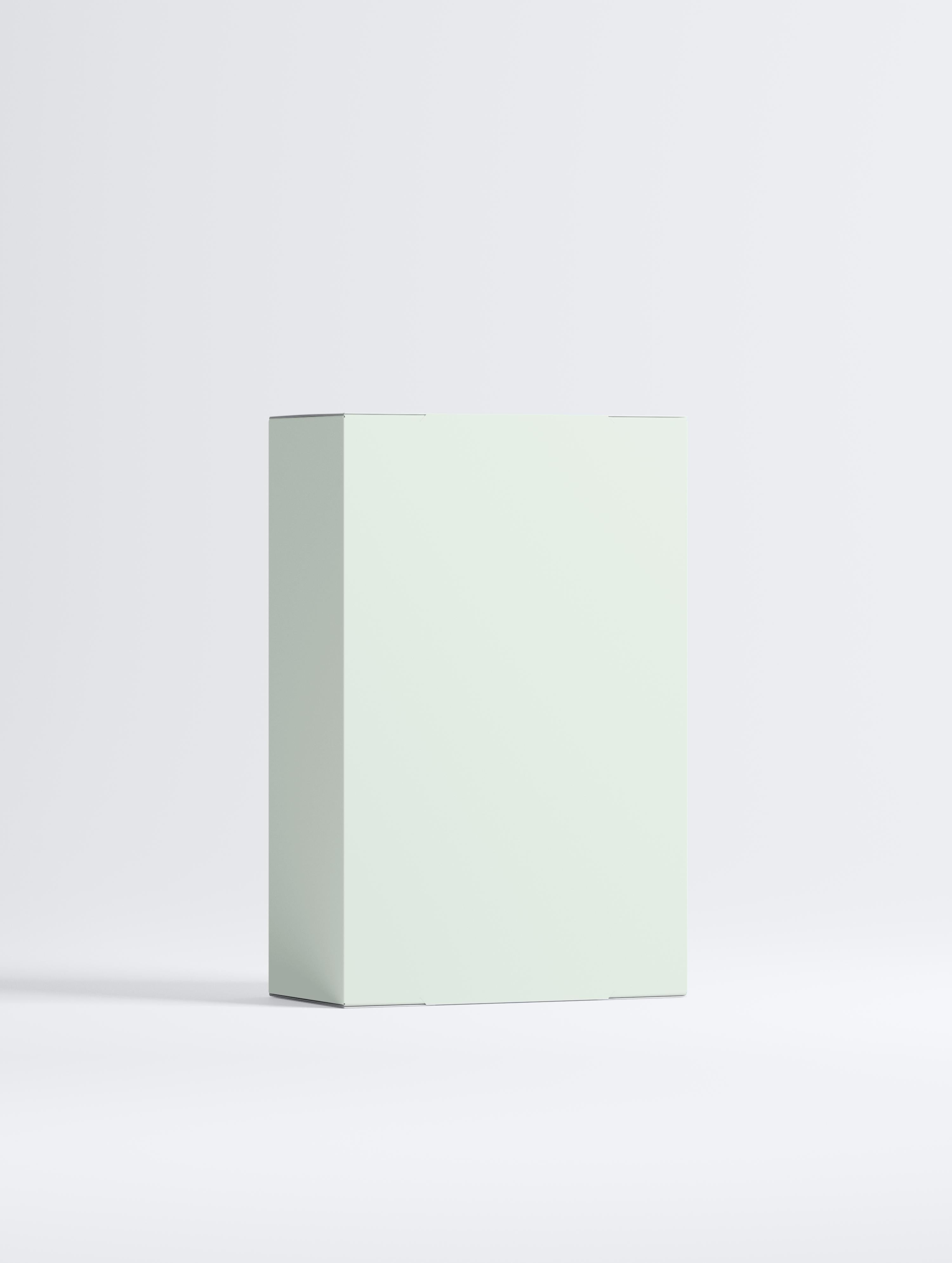 Anti Age Performance Duo skincare set box in soft green color on a plain background.